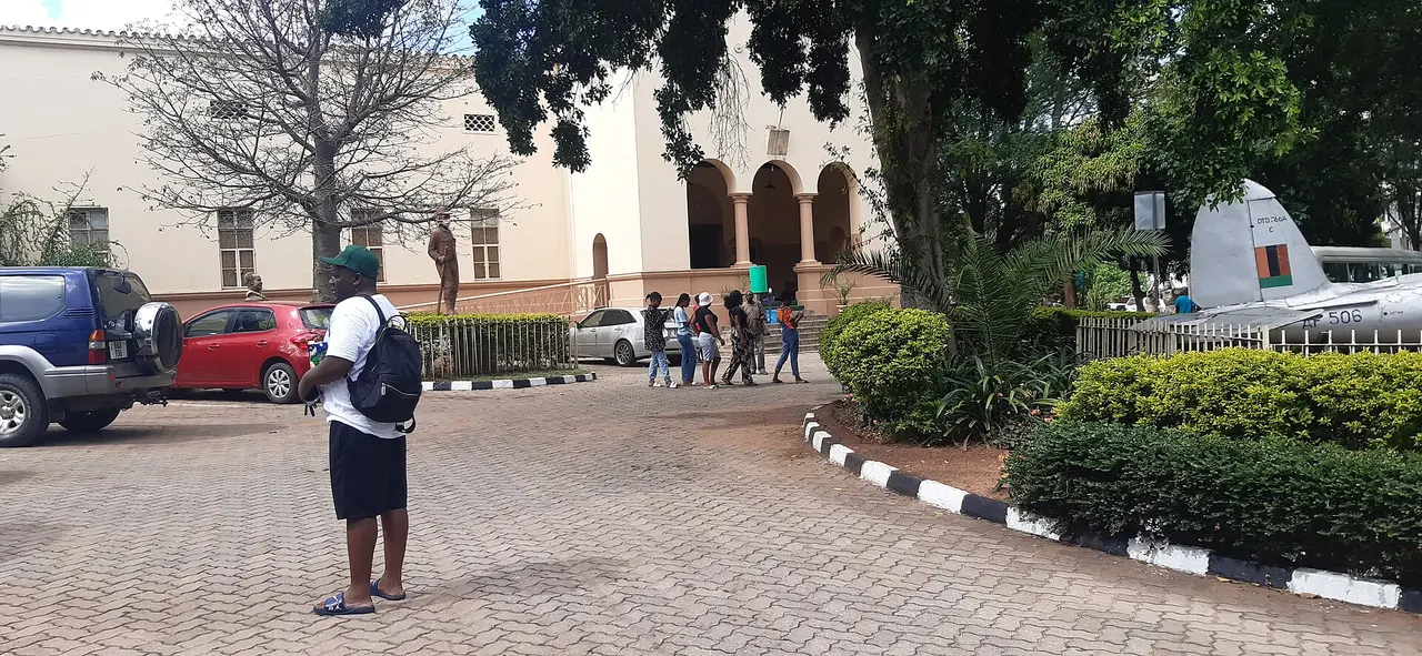Front courtyard of the Livingstone Museum in Livingstone, with visitors and trees
